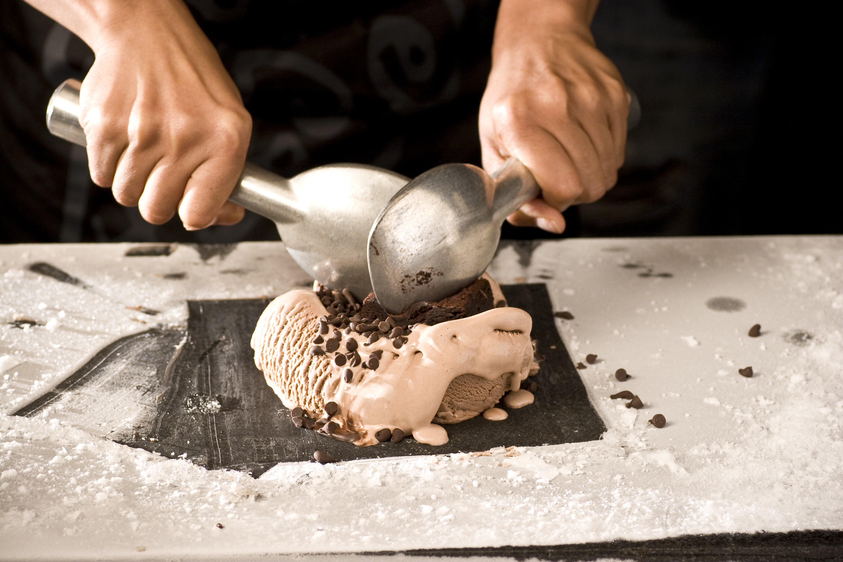 Making rolled ice cream, a Thai street food 